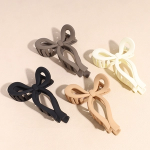 Matte finish butterfly hair claw clips in four earth-tone colors for women