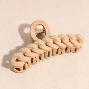 Close-up of matte milk tea brown large hair claw clip with stylish chain link design