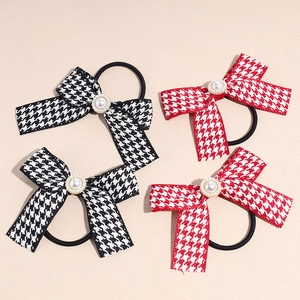 Set of four tweed houndstooth bow hair ties with pearl centers in red and black