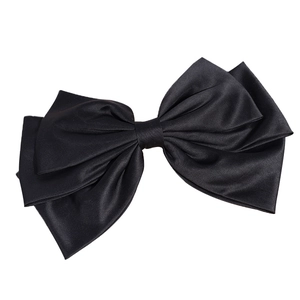 Elegant oversized black satin bow hair clip with a layered silk texture on white background