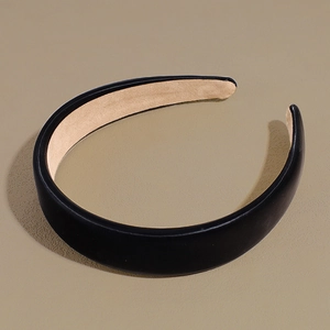 Macro view of padded black matte leather headband with soft anti-slip lining