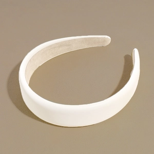 Detail of minimalist wide matte PU leather headband with non-slip velvet inner lining