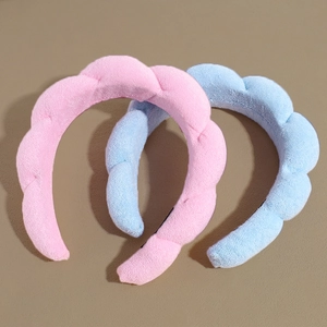 Braided terry cloth sponge headbands in pink and blue for daily skincare and makeup