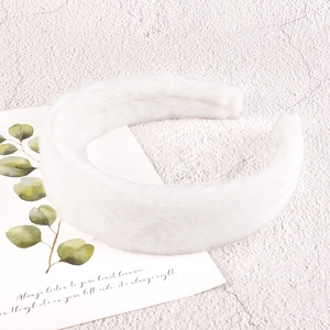 Plush faux fur headband in white color for women with soft fluffy texture