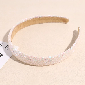 Detailed macro view showing the pink sequin texture and non-slip lining of the headband
