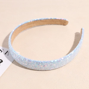 Close-up of light blue sequined headband with soft faux suede lining and glitter finish