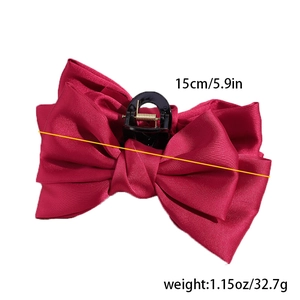 Close-up of 15cm dark red silk bow hair claw clip with strong black plastic teeth