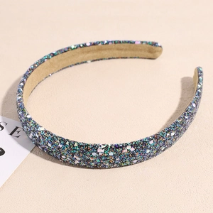 Detailed macro view of sparkling sequins on a pink wide headband with anti-slip inner fabric