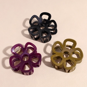 Three-piece floral hair claw set in black, burgundy, and olive green with a glossy finish