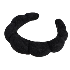 Puffy black bubble headband with thick sponge padding and textured velvet fabric