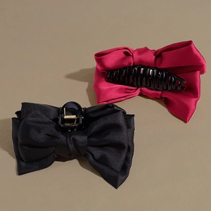 Large double-sided bow hair claw clips in black and rose red with silk satin finish