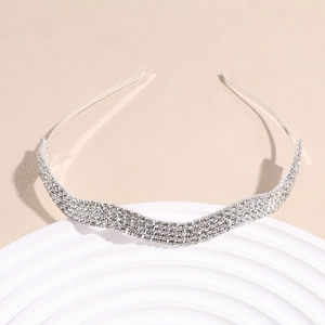 Elegant wavy silver headband with five rows of sparkling white crystals for bridal hair