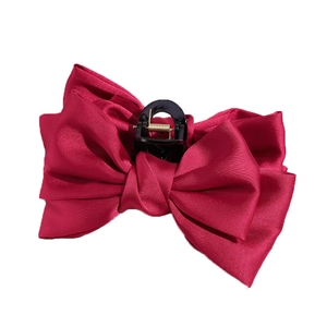 Large red satin bow hair claw clip with multi-layer silk ribbon and sturdy metal spring