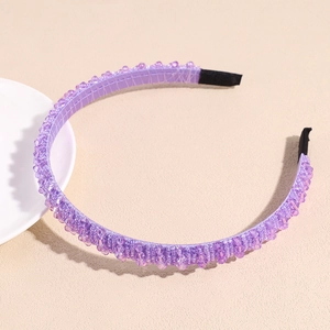 Detailed view of light purple beaded headband with crystal beads and fabric tips