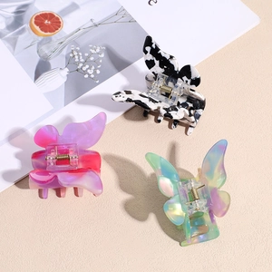 Three-piece set of butterfly acetate hair claws in marble and iridescent gradient patterns