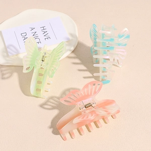 Three gradient butterfly hair claws in pastel resin with pearlescent finish for women