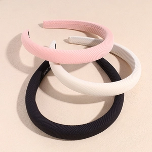 Three-piece solid color fabric sponge headbands in pink, white, and black sets