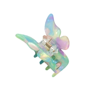 Elegant butterfly hair claw with iridescent marble texture and colorful acetate finish