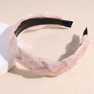 Detail of light pink braided headband with sparkling beadwork and anti-slip inner teeth