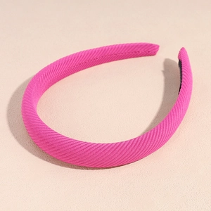 Detail showing hot pink ribbed fabric headband texture with black anti-slip lining