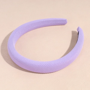 Close-up of lavender sponge headband showing fine twill fabric texture and anti-slip lining