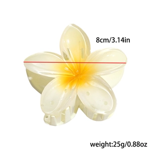 Detailed view of yellow plumeria flower hair claw clip with size and weight info