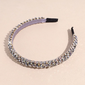 Macro detail of Baroque headband showing iridescent crystals and golden beaded ornaments