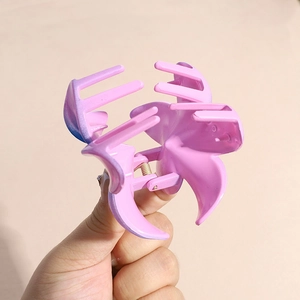 Pink and purple gradient plumeria flower hair claw clip with a glossy candy finish