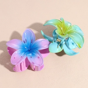 Translucent flower claw clips in gradient blue and green candy colors for hair styling