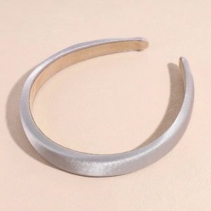 Detail of silver-grey satin padded headband showing non-slip inner lining and thick sponge