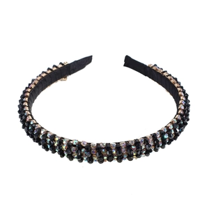 Handmade Baroque headband featuring black beads and colorful crystals on a slim sponge frame