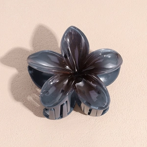 Detail shot of translucent gray flower hair claw clip with smooth resin finish