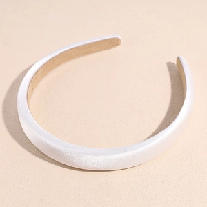 Detail showing high-gloss white satin headband with thick sponge and non-slip lining
