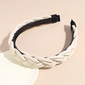 Detail of cream woven headband with non-slip teeth and premium faux leather texture