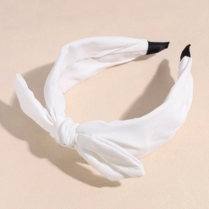 Detail of white chiffon bow headband with non-slip end tips for a sweet minimalist style