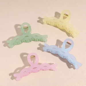 Set of four matte large shark hair claws in pastel colors with a twisted woven design