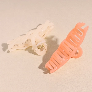 Set of large matte shark hair clips in cream and peach colors for hair styling
