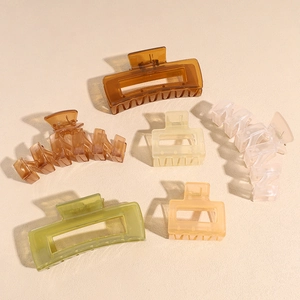 Set of six colorful large shark hair clips in assorted shapes with smooth resin finish