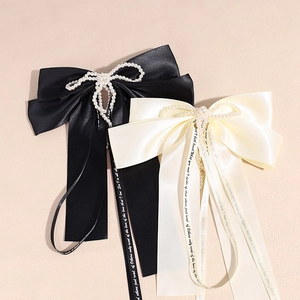 Set of black and beige satin bow hair clips with pearls and elegant long ribbons