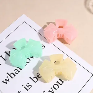 Elegant jelly-colored acrylic bow hair claws in pink, mint green and cream white