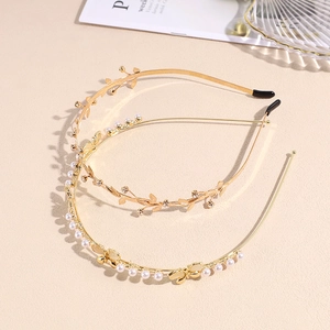 Elegant gold pearl headband with leaf rhinestones and butterfly accents for women