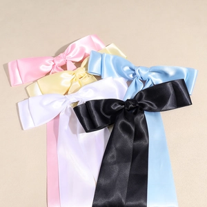 Elegant satin bow hair clips with long ribbons in multiple pastel colors and silk finish