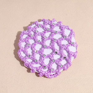 Close-up of purple woven hairnet with sparkling rhinestones for elegant ballet buns