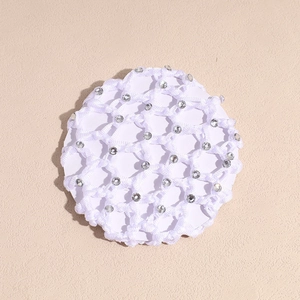 Close-up of white crocheted hairnet with rhinestones for ballet bun or nurse uniform