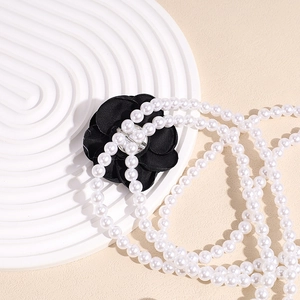Elegant camellia pearl waist chain and necklace for dresses with black fabric flower detail
