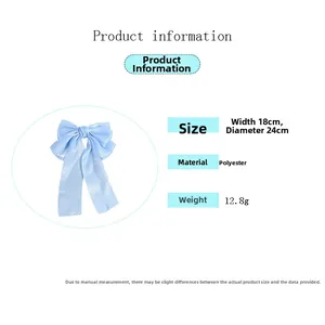 Détail du nœud papillon bleu montrant les dimensions 18x24cm et le matériau polyester