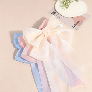 Lot de barrettes nœuds élégantes en organza coloris ivoire, rose et bleu clair