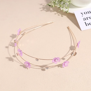 Detail of golden double-layered headband with lavender flowers, pearls and rhinestones