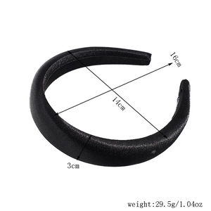Detailed view of black satin padded headband with dimensions of 16x14cm and 3cm width