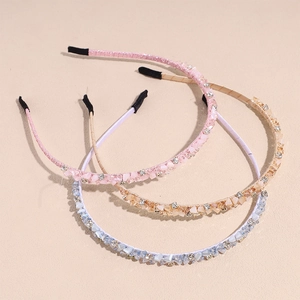 Three-piece set of slim rhinestone headbands in pink, champagne gold, and light blue colors
